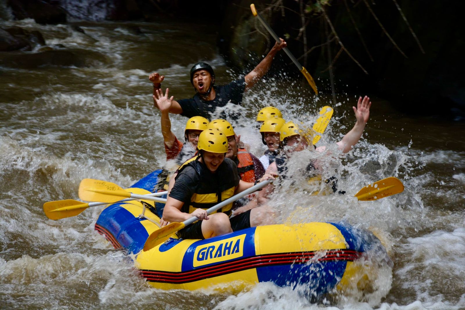 Rafting crew navigating white water rapids